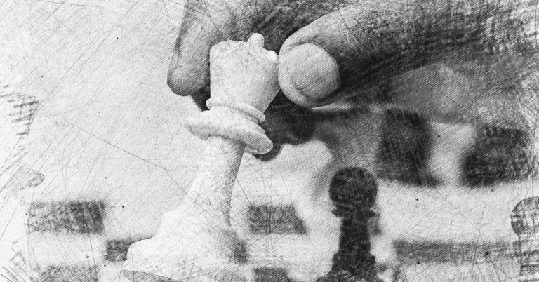 Hand moving a chess piece